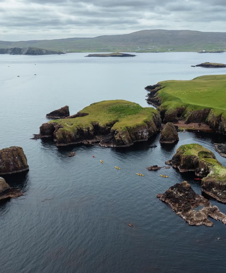 An aerial shot of a kayaking expedition